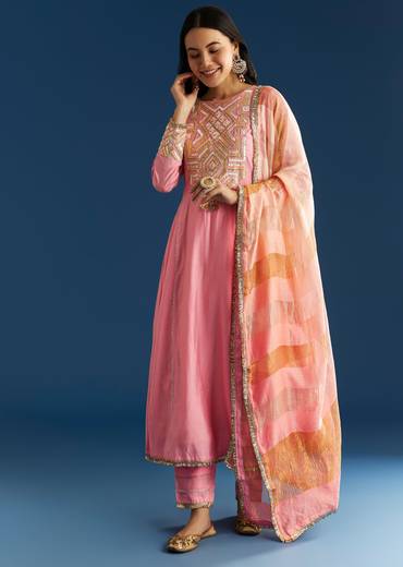 Soft Festive Couple Set – Pink Muslin Gotta Work Anarkali With Pant And Dupatta For Her And Pink Floral Print Art Silk Kurta Pant Set For Him