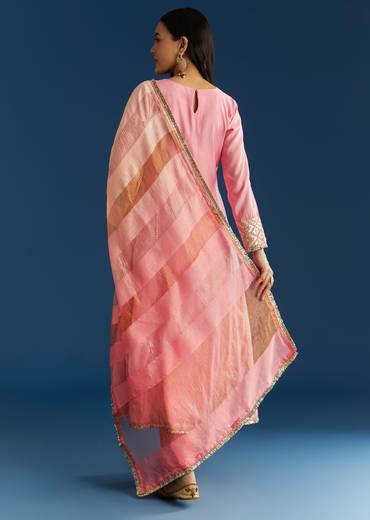 Soft Festive Couple Set – Pink Muslin Gotta Work Anarkali With Pant And Dupatta For Her And Pink Floral Print Art Silk Kurta Pant Set For Him