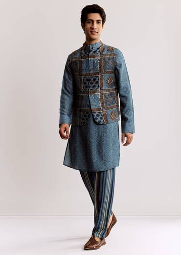 Coordinated Festive Couple Set – Blue Printed Kurti Palazzo Set With Embroidery For Her And Blue Linen Kurta Jacket Set With Ajrakh Print For Him