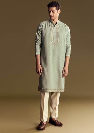 Emerald Green Celebration Pair – Zardozi Palazzo Suit For Her And Pastel Green Embroidered Linen Kurta Set For Him
