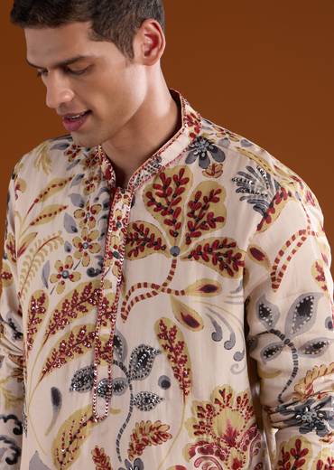 Heritage Maroon Elegance Couple Set – Maroon Printed Zari Kurta Set with Pant and Dupatta for Her And Cream Embroidered Rawsilk Kurta Set for Him