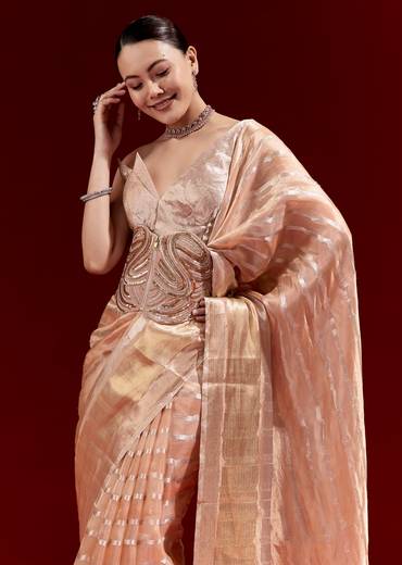 Elegant Festive Couple Set – Peach Banarasi Tissue Saree with Cutdana Belt for Her And Off-White Silk Motif Kurta Set for Him