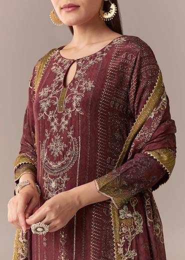 Heritage Maroon Elegance Couple Set – Maroon Printed Zari Kurta Set with Pant and Dupatta for Her And Cream Embroidered Rawsilk Kurta Set for Him