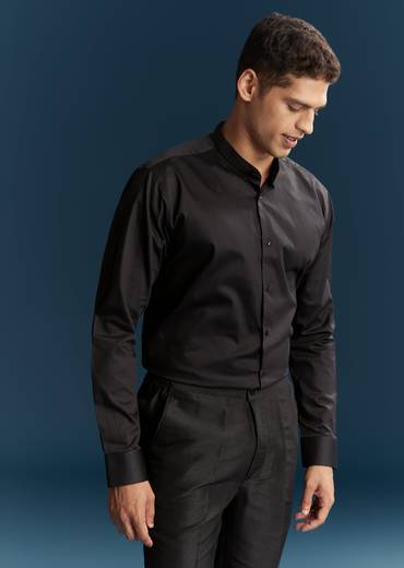 Bold Evening Couple Set – Black Heavy Embroidered Net Saree With Cutwork Border For Her And Black Embroidered Corduroy Shirt Jacket For Him