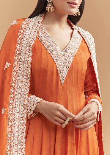 Vibrant Celebration Couple Set – Orange Chinon Hand-Embroidered Anarkali for Her And Orange Silk Kurta Jacket Set with Zardosi Work for Him