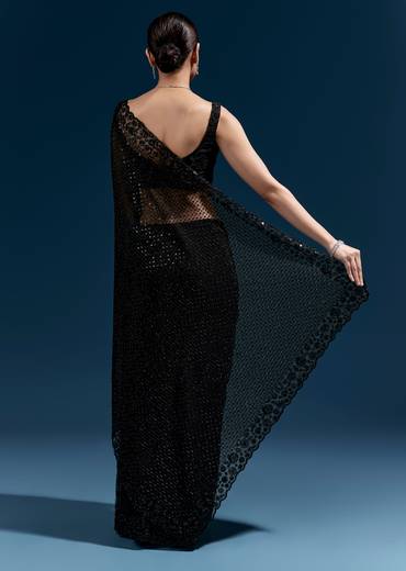 Bold Evening Couple Set – Black Heavy Embroidered Net Saree With Cutwork Border For Her And Black Embroidered Corduroy Shirt Jacket For Him