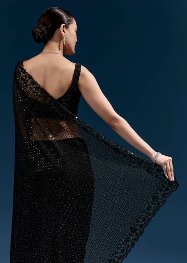 Bold Evening Couple Set – Black Heavy Embroidered Net Saree With Cutwork Border For Her And Black Embroidered Corduroy Shirt Jacket For Him