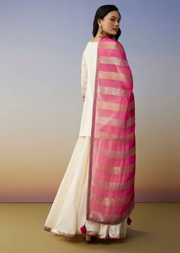 Classic Festive Couple Set – White Silk Palazzo Suit With Moti Zardosi Work For Her And Pink Silk Kurta Set With Mirror And Thread Work For Him