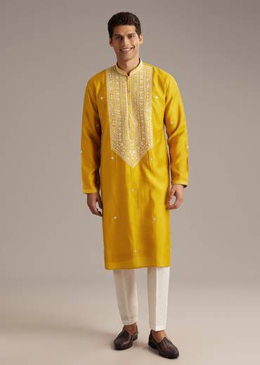 Mustard Yellow Coordinated Attire – Embellished Sharara Suit For Her And Yellow Silk Mirror Work Kurta Set For Him