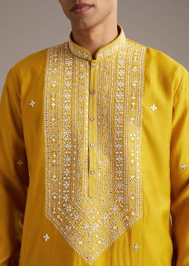 Mustard Yellow Coordinated Attire – Embellished Sharara Suit For Her And Yellow Silk Mirror Work Kurta Set For Him