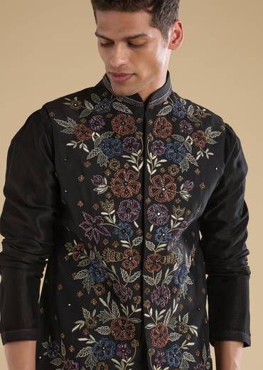 Indigo Noir Festive Couple Set – Indigo Printed Crop Top & Skirt Set for Her And Black Embroidered Silk Kurta Jacket Set for Him