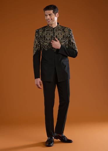 Bold Festive Couple Set – Black Silk Palazzo Suit With Zari Thread And Sequins Work For Her And Black Suiting Jodhpuri Pant Set With Embroidery For Him