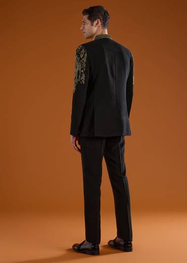 Bold Festive Couple Set – Black Silk Palazzo Suit With Zari Thread And Sequins Work For Her And Black Suiting Jodhpuri Pant Set With Embroidery For Him