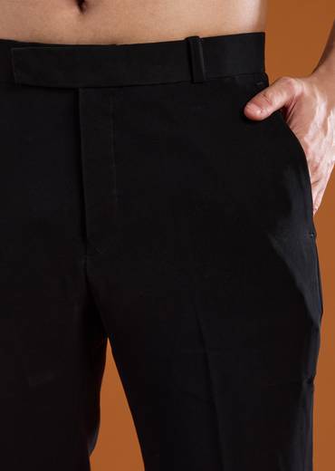 Bold Festive Couple Set – Black Silk Palazzo Suit With Zari Thread And Sequins Work For Her And Black Suiting Jodhpuri Pant Set With Embroidery For Him