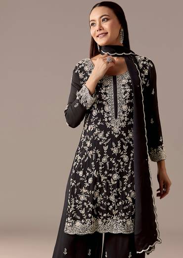Midnight Black Royal Pair – Pakistani Style Palazzo Suit For Her And Black Silk Kurta With Embroidered Nehru Jacket For Him