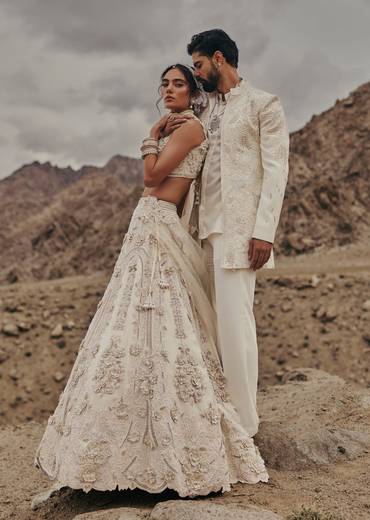 Off White Crystal Embroidered Bridal Lehenga For Her & Satin Embroidered Bandhgala For Him
