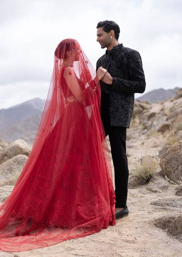 Ruby Red Satin Bridal Lehenga For Her & Black Embroidered Tuxedo For Him