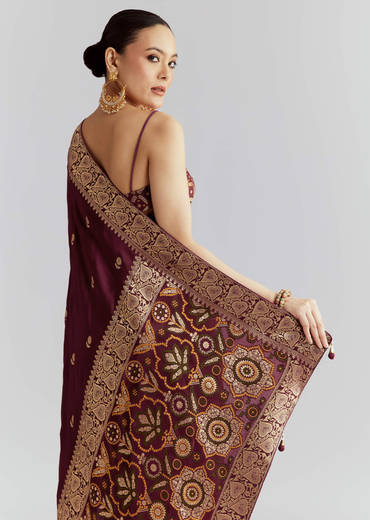 Wine Silk Woven Saree With Floral Motif Work
