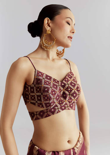 Wine Silk Woven Saree With Floral Motif Work