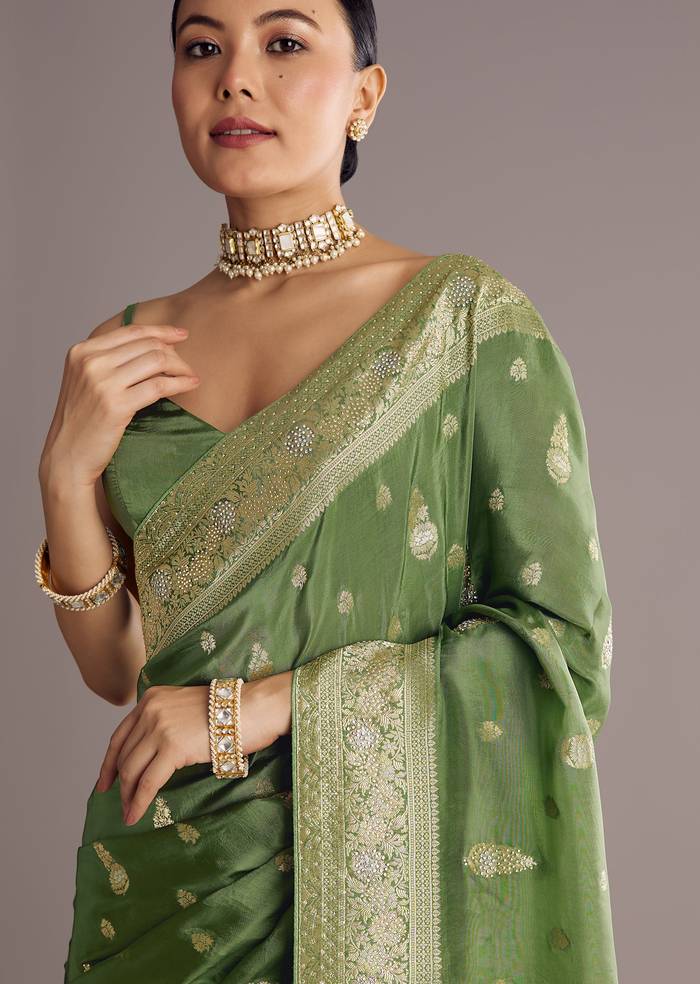 Pista Green Saree With Zari Weave And Stone Embellishments