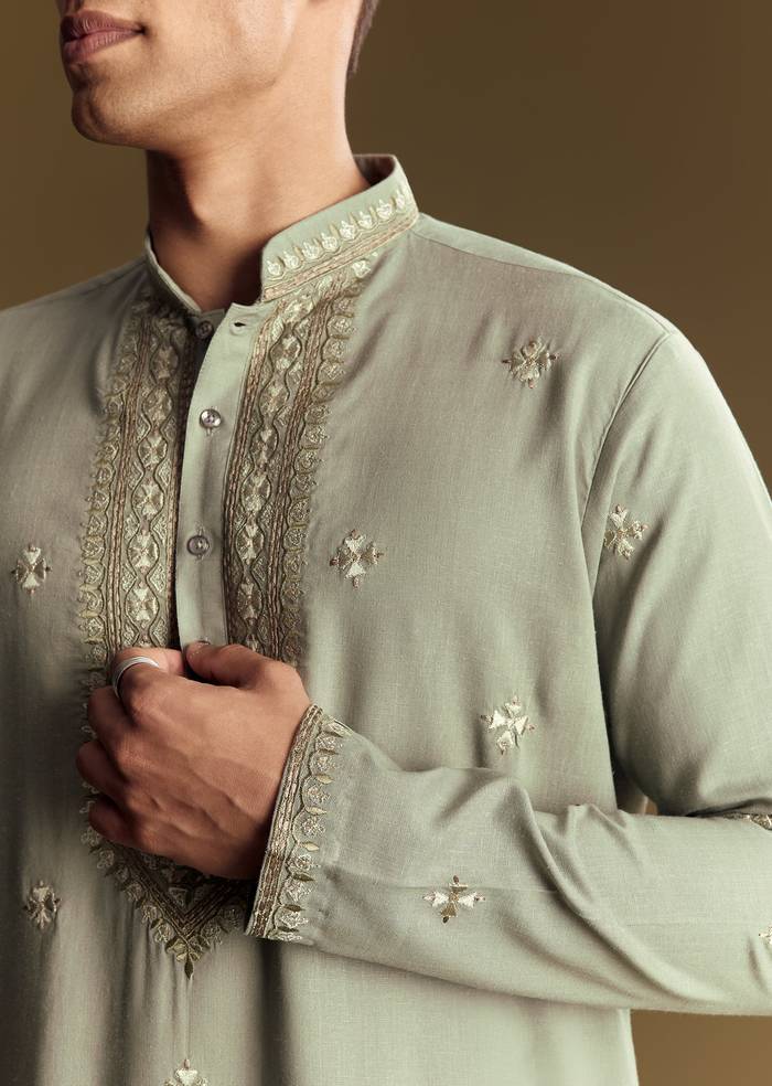 Emerald Green Celebration Pair – Zardozi Palazzo Suit For Her And Pastel Green Embroidered Linen Kurta Set For Him