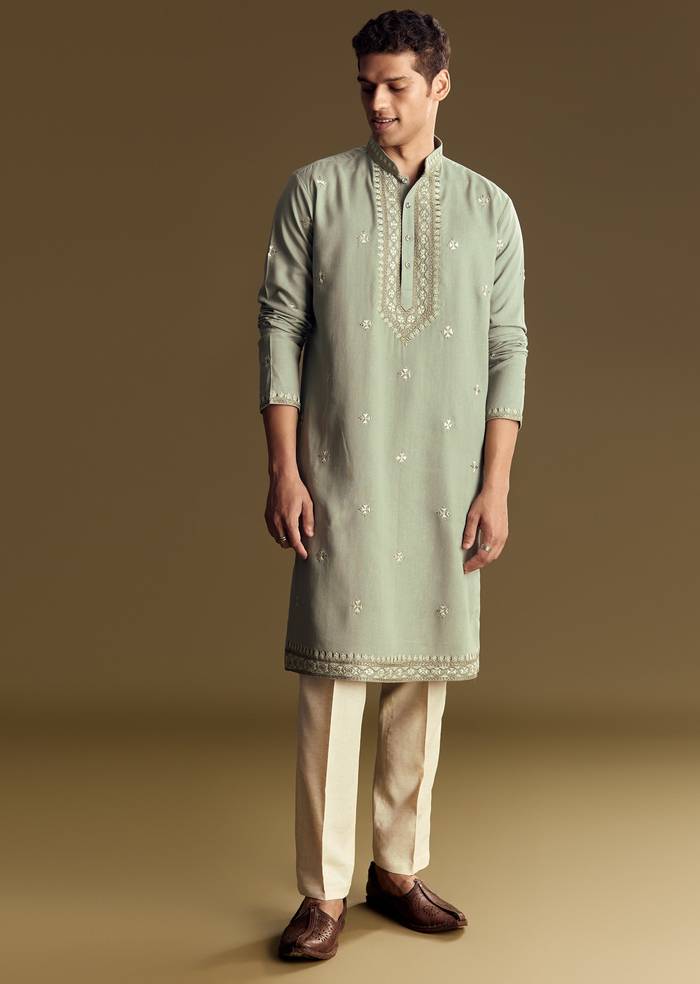 Emerald Green Celebration Pair – Zardozi Palazzo Suit For Her And Pastel Green Embroidered Linen Kurta Set For Him