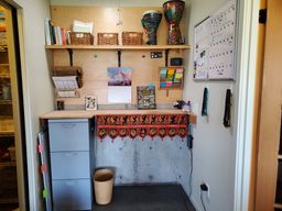 Office nook with standing desk. Solatube provides daylight. Attic access via drop down stairs above.