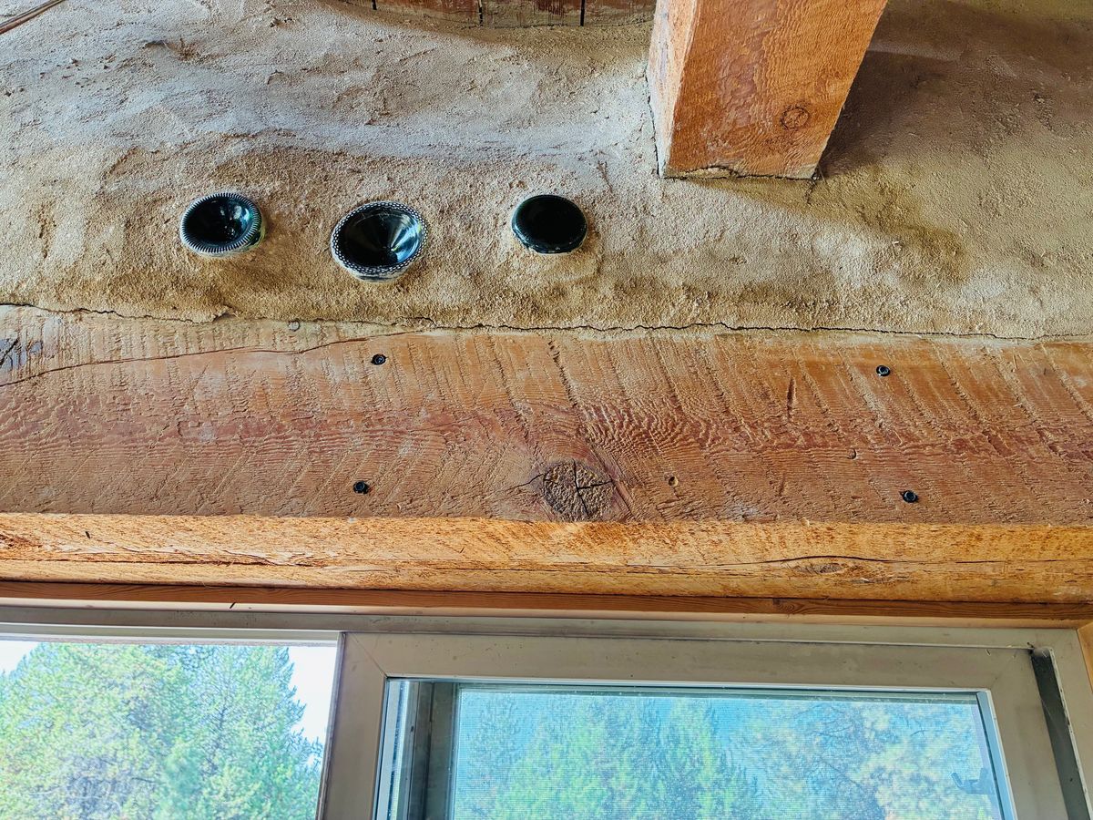 Bottle inlays and natural plaster walls.