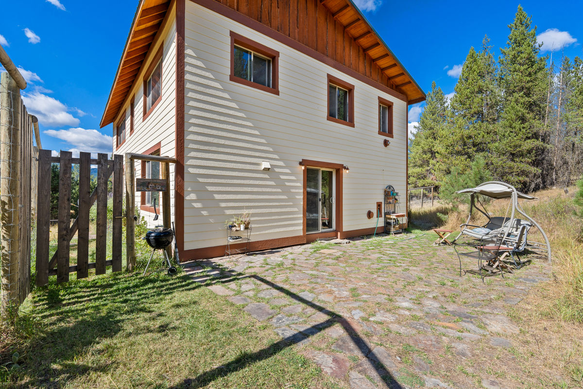Custom stone patio with sliding door entrance.