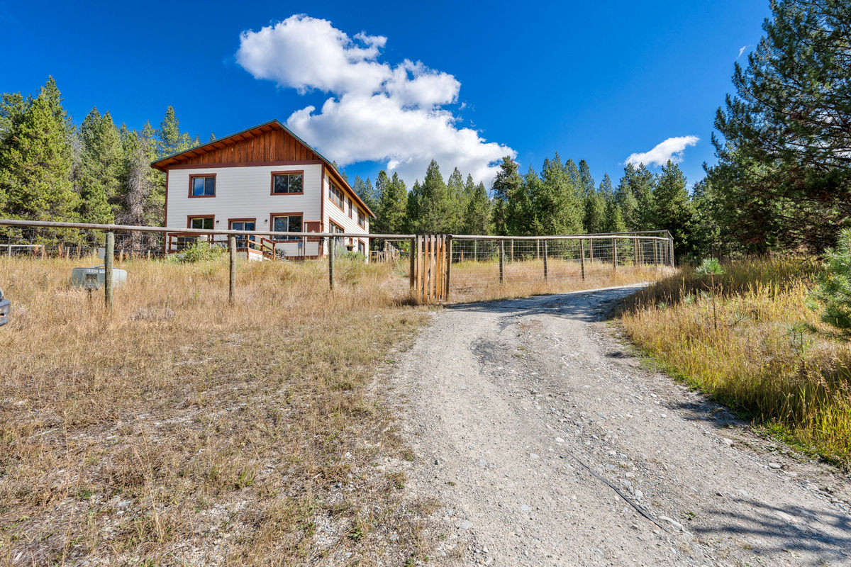 Driveway approach with fenced yard.
