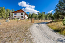 Driveway approach with fenced yard.