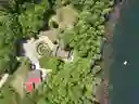 Swimming raft in Lake Alice.  Spiral meditation walkway in polinator garden surrounded by Hugelkulture vegetable bed.