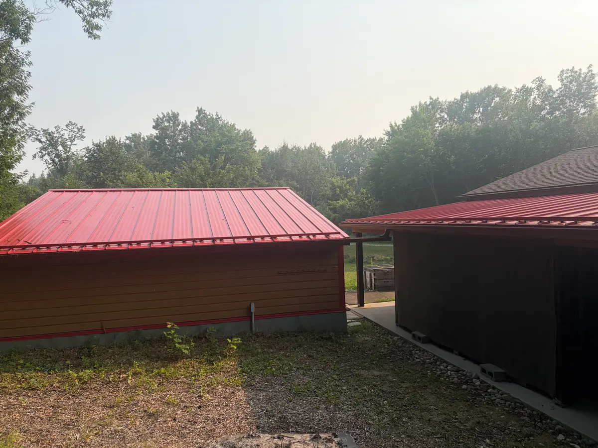 Galvalume roofs of lumber shed and DWG gather rainwater for DWG. Rusty Shed roof does the same for domestic water there.