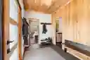Entry with ample hanging storage
Secret door to attic space concealed above bench 