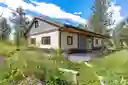 Sunny Gardens w Hugelkultur beds throughout protected by 8' metal deer fence 