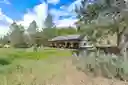Native established plantings surround the home