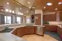 Custom Kitchen with Leathered Granite Countertops, Pendant and Recessed Lighting, Soft-Close, Custom-Made Cherry Cabinets and 2 Light Tunnels