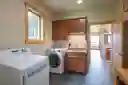 Laundry room on main level with utility sink. 