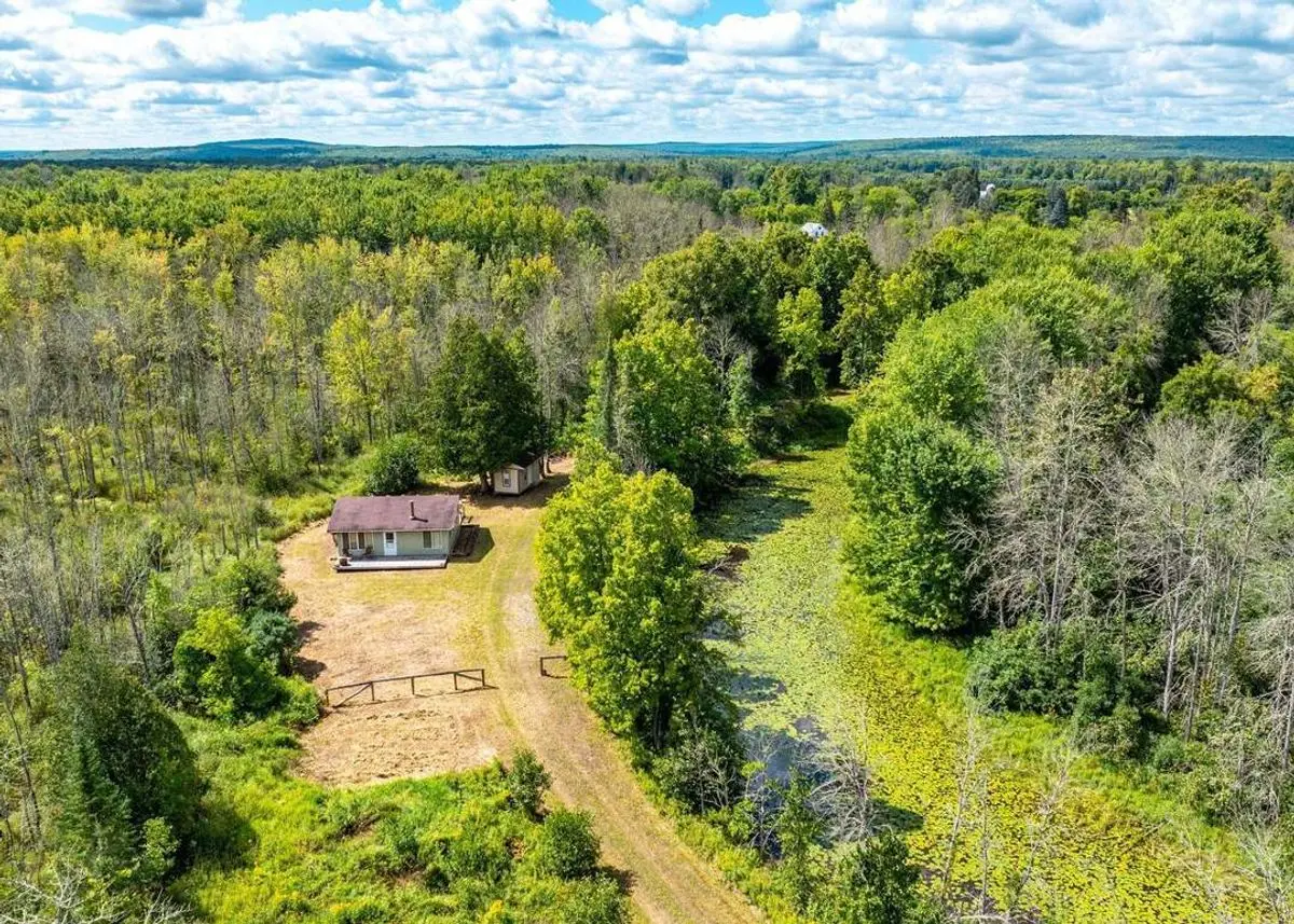 Photo 1 of green home in Baraga, Michigan