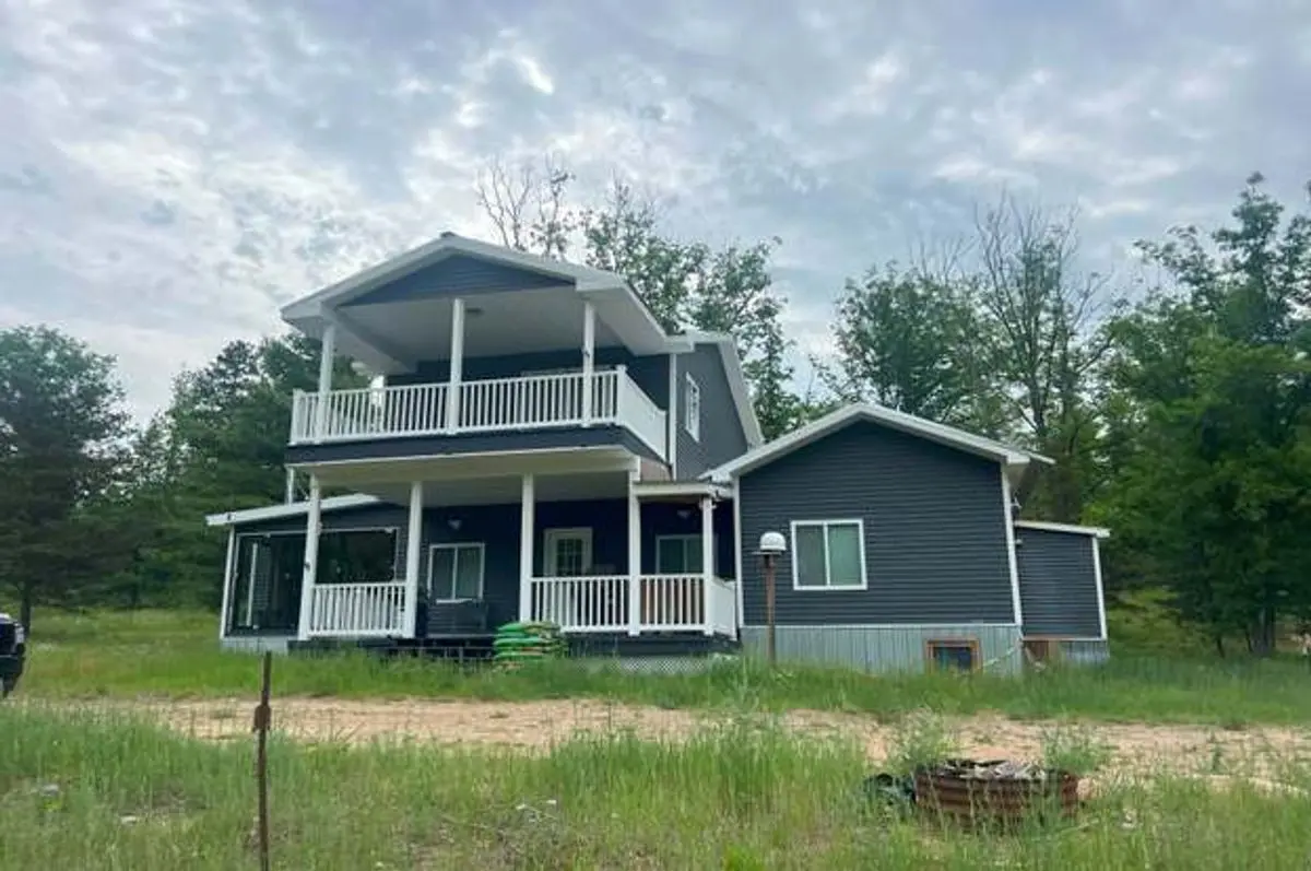 Photo 2 of green home in Ossineke Twp, Michigan