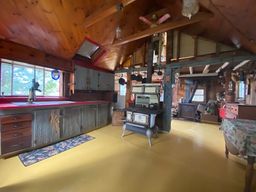 Kitchen, as you walk in the main door. The cupboards, wall, and skylight were redone recently (see next photo)