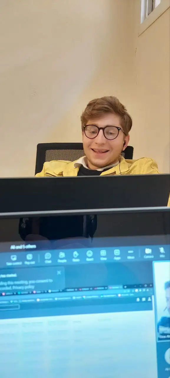 Light-hearted moment during a remote SOC team meeting, reflecting positive team spirit and collaborative work culture