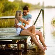 loving-couple-sitting-on-the-pier-on-lake-2022-04-19-00-13-57-utc_JZGUE9x19.jpg