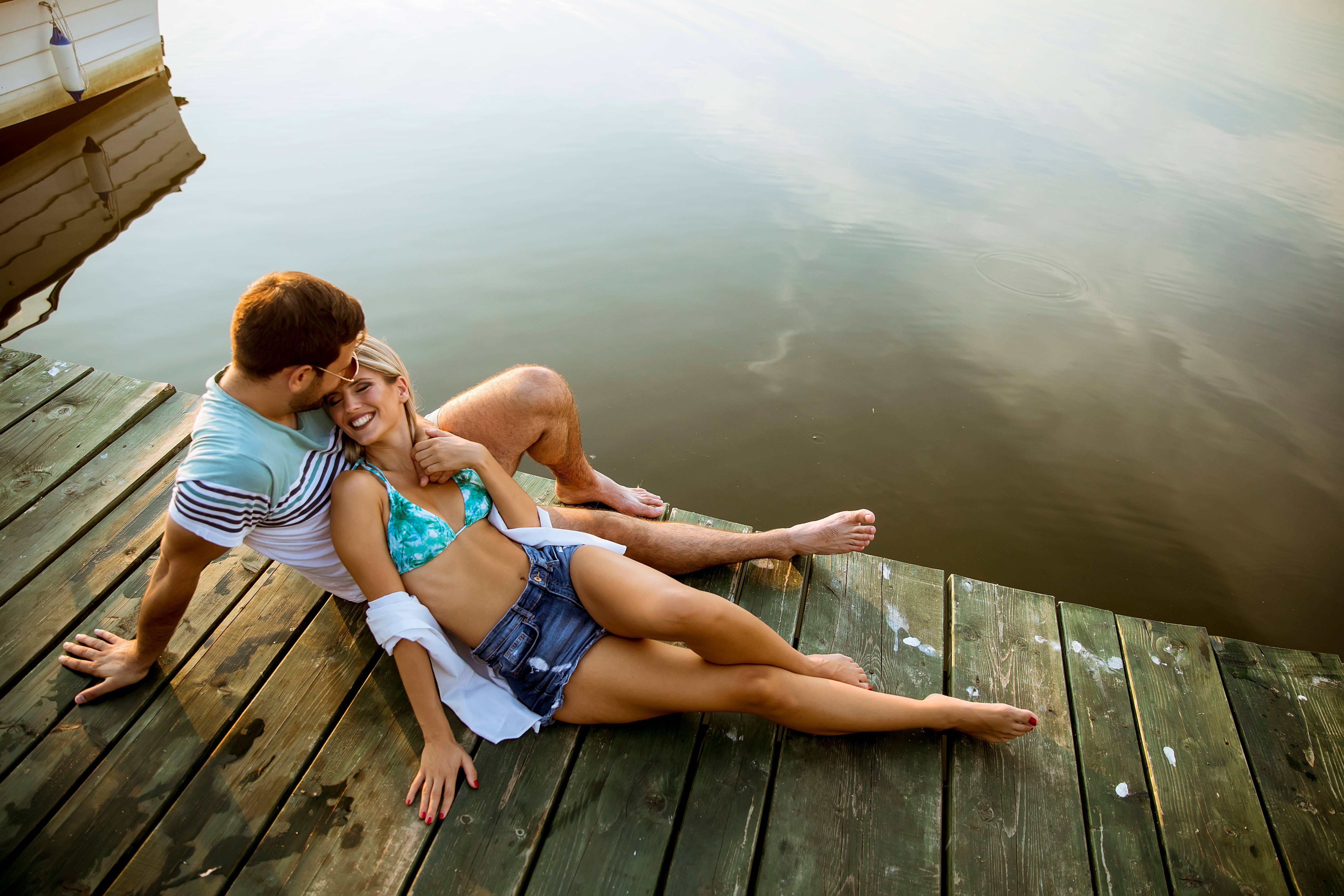 loving-couple-sitting-on-the-pier-on-lake-2022-04-19-00-17-29-utc_LIw9OvzXp.jpg