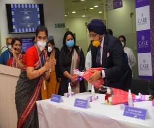 Dr Sandeep Singh best orthopedic doctor in Bhubaneswar felicitating a women in Care hospital Bhubaneswar Dr Sandeep Singh best orthopedic doctor in Bhubaneswar felicitating a women in Care hospital Bhubaneswar