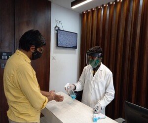 Advanced Speciality Homeopathy clinic keeping the hands of patients sanitised