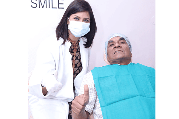 Dr Suchi with a patient in centre for Smiles, Noida Dr Suchi with a patient in centre for Smiles, Noida
