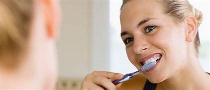 A person brushing the teeth