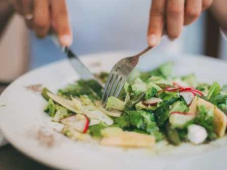 A picture containing person, food, plate, indoor
Description automatically generated