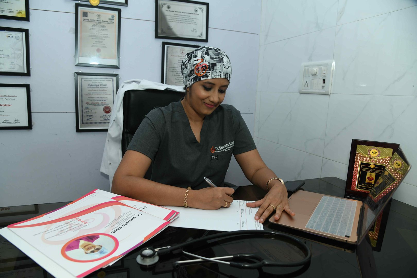 Dr. Shweta Shah writing prescription for patients